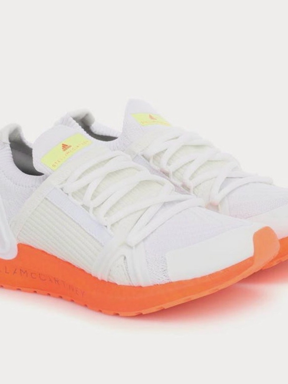 adidas White Knit Sneakers with Orange Sole and Yellow Accent